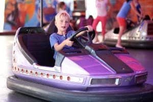 young boy driving bumper car at Dollywood