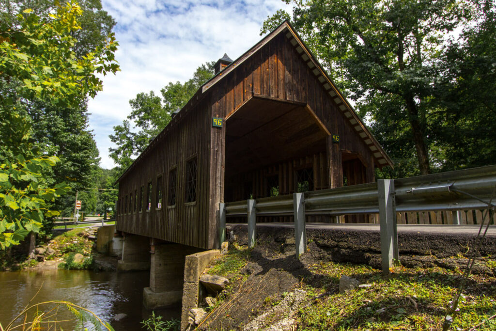 a road with the barn looking tunnel in The Great Smoky Mountains National Park