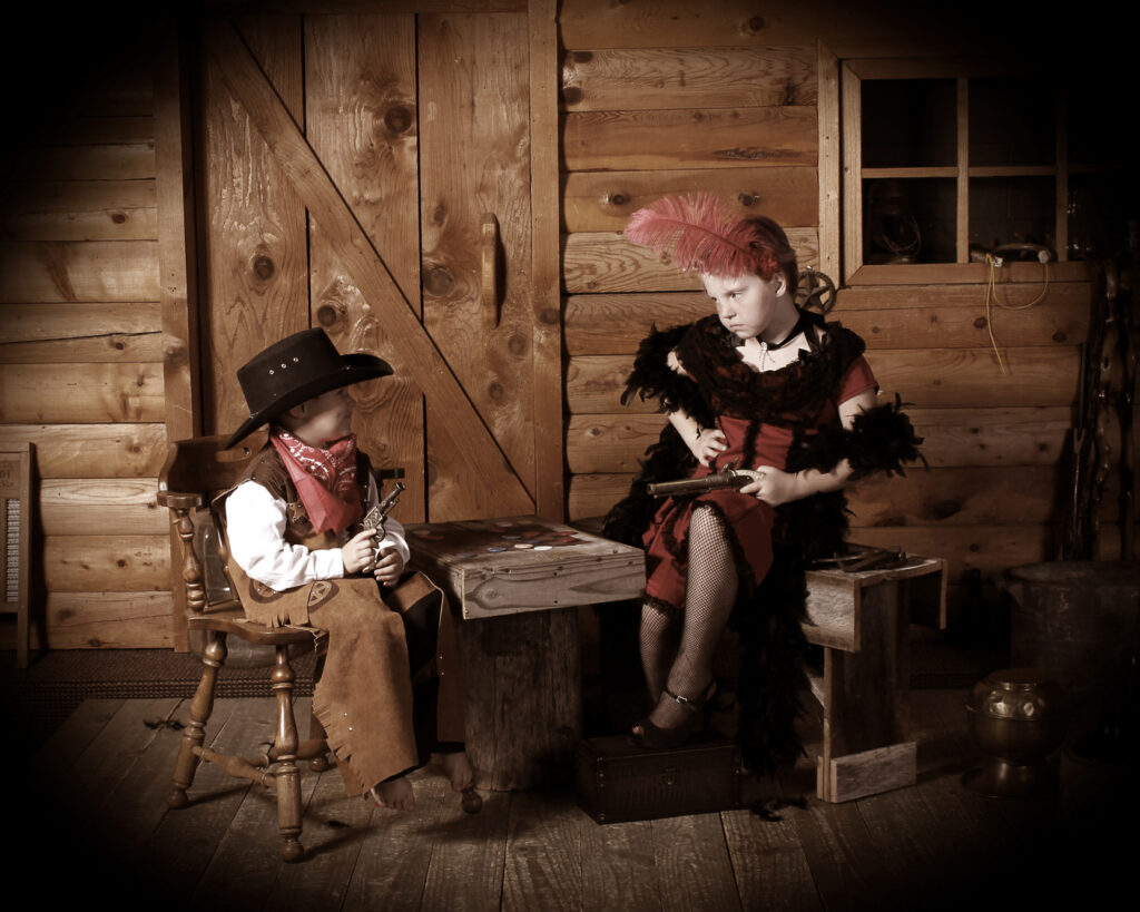 boy and a girl posing in costumes