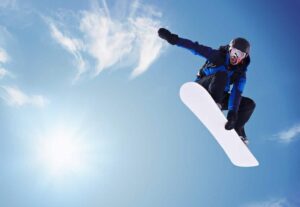 A snowboarder flying through the air.