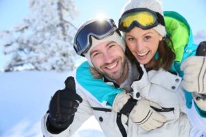 Happy couple on a ski trip together.