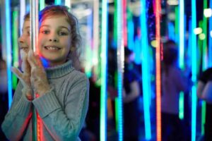 little girl in mirror maze