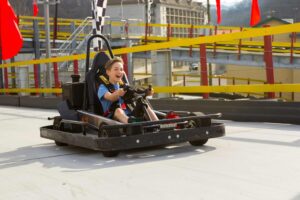 boy driving a go kart