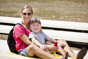 mother and son riding mountain coaster