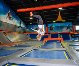 A child is doing back flip on a trampoline at Sevier Air Trampoline Park