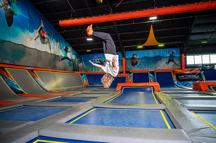 A child is doing back flip on a trampoline at Sevier Air Trampoline Park