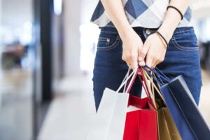 woman holding shopping bags