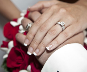 bride and groom holding hands