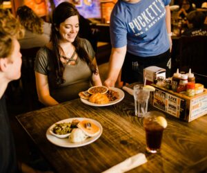 a couple is having dinner at Puckett’s