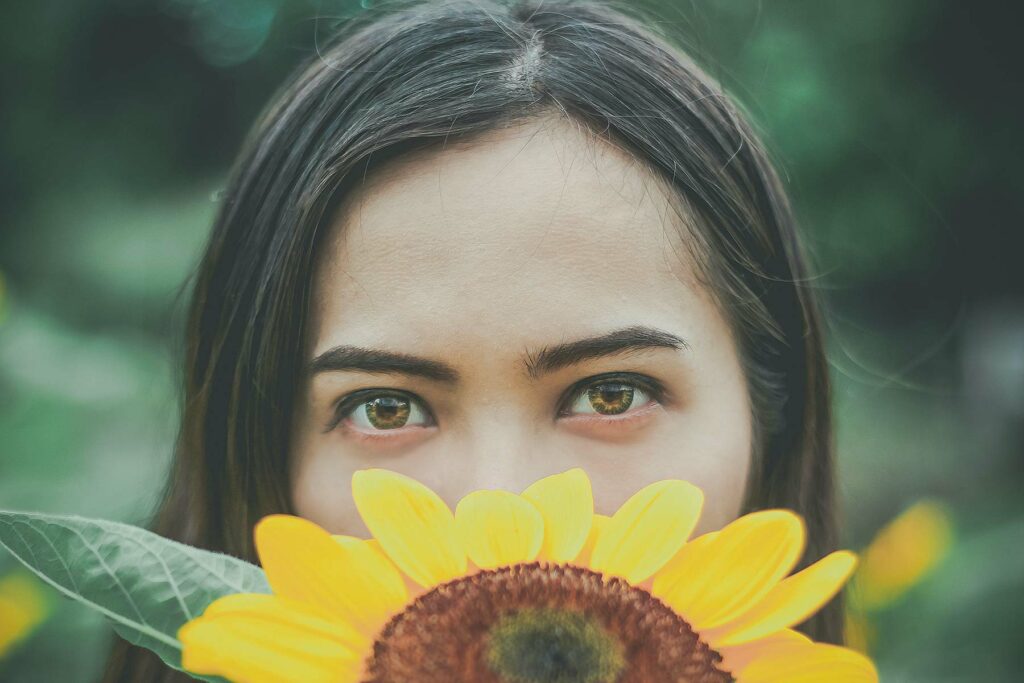 girl behind the sunflower